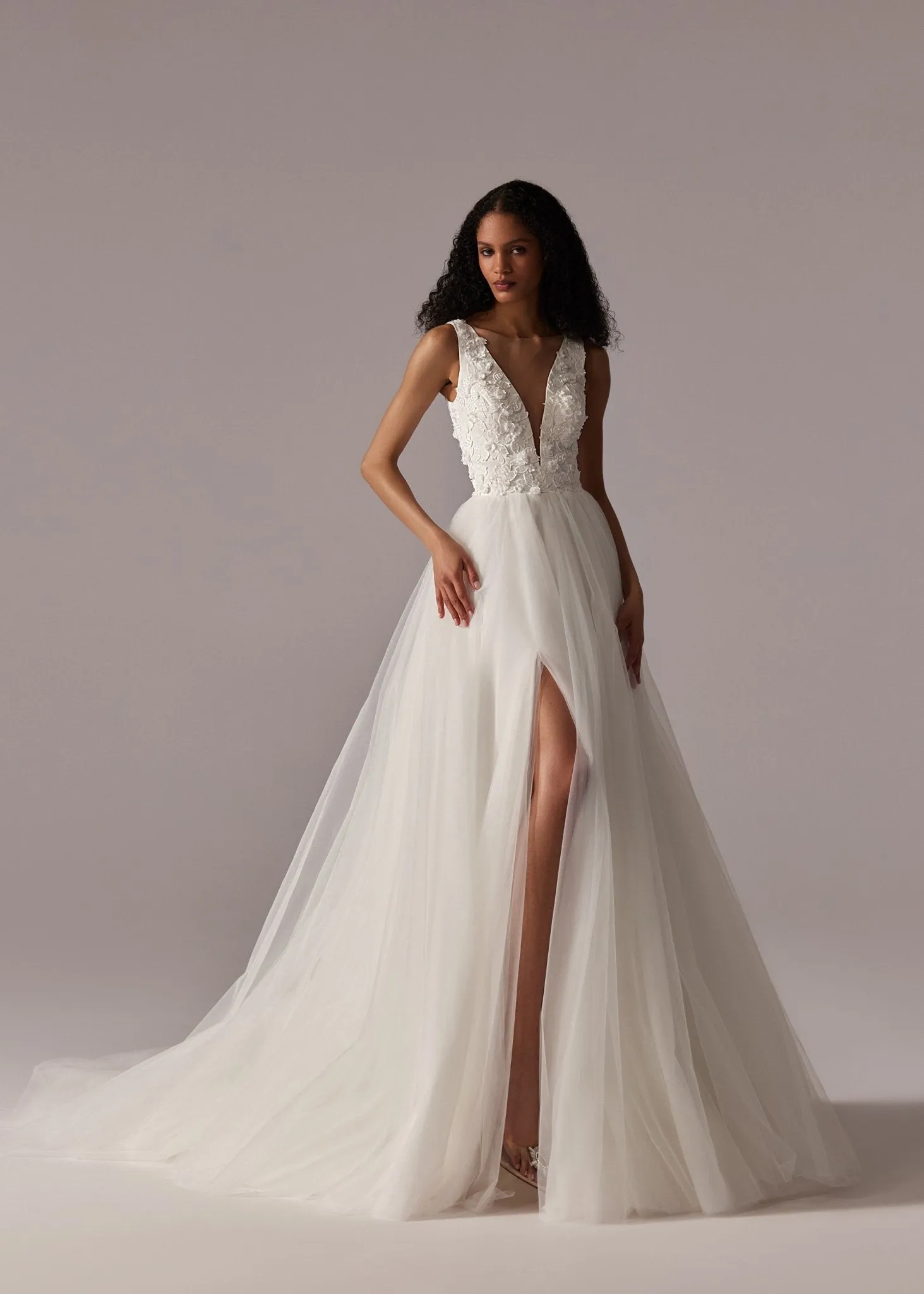 White Plunging V-Neck Wedding Dress with Floral Lace Bodice, High Slit, and Floor-Length Tulle Train - Plus Size