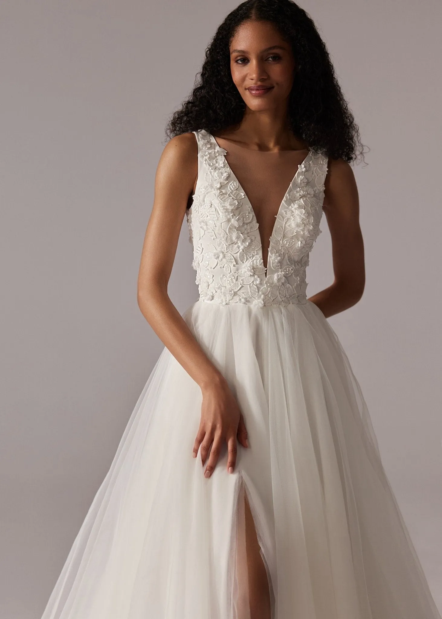 White Plunging V-Neck Wedding Dress with Floral Lace Bodice, High Slit, and Floor-Length Tulle Train - Plus Size